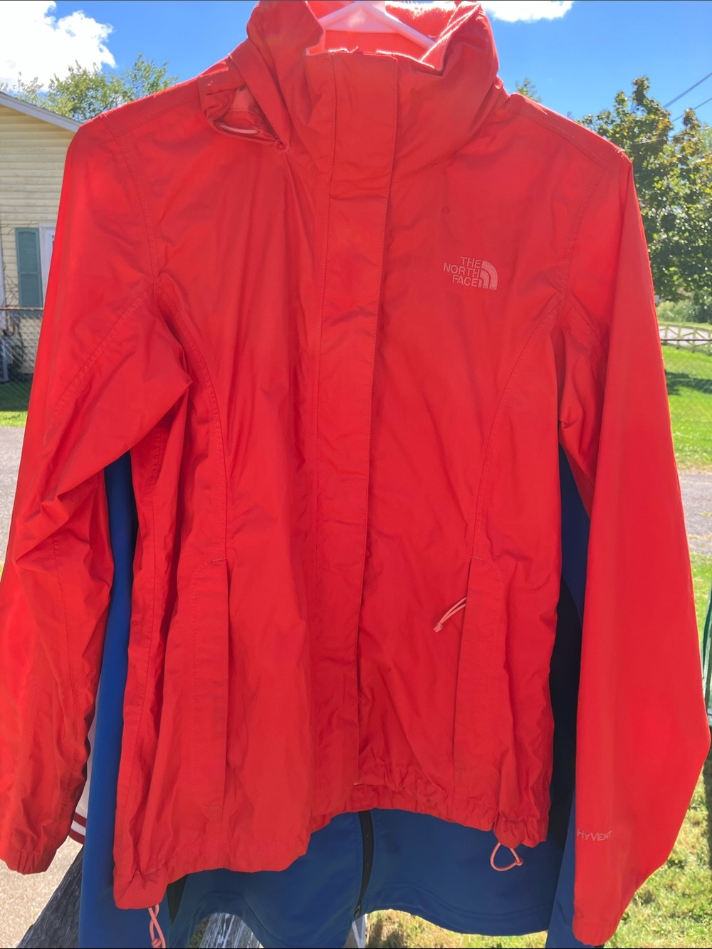 The North Face Women's Bright Orange rain jacket with Hood